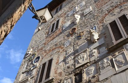 Coats of arms on the facade of the Palazzo Pretorio in Campiglia Marittima
