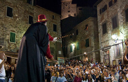 Piazza della Repubblica in Campiglia Marittima full of people for the performances of the Festival of street arts, Apritiborgo