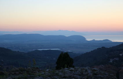 View from Campiglia Marittima towards the gulf of Baratti, Elba and Corsica, sunset, autumn. 